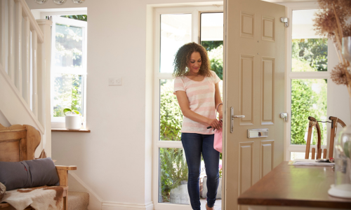 Woman opening door with keys